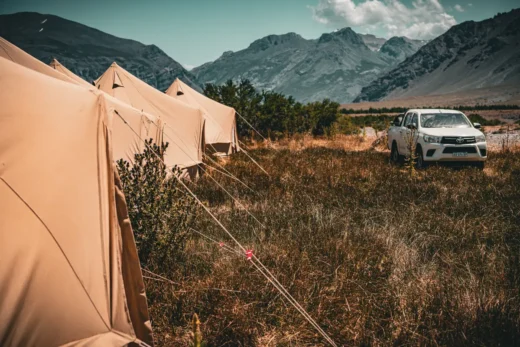 Mobile safari camp tent and support vehicle set up in the Patagonian steppe
