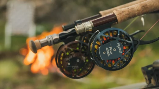 Fly rod and reel resting by the fire at the end of the day