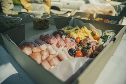 Cold cuts and cheese platter served for lunch in the field
